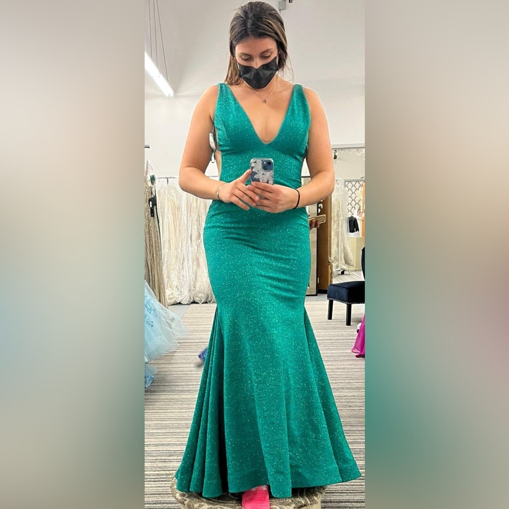 Javoni plunge neckline, mermaid flare bottom, sparkly green prom dress